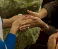 Hands showing the Holy Kiss greeting